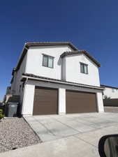 View of back of property featuring a garage