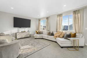 This room is spacious, you can easily fit a large sectional facing the TV. Their furniture is quite large