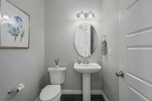 Bathroom featuring sink and toilet