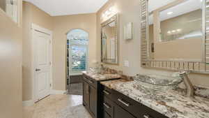 Bathroom featuring vanity and tile patterned flooring