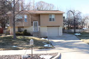 Raised ranch featuring a garage