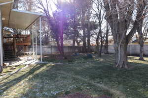 View of yard with a patio area and a wooden deck