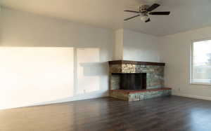 Living room with fireplace, abundant light