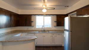 Kitchen with new light stone countertops and plenty of cupboard space