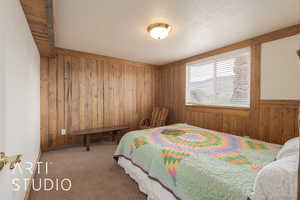 Carpeted bedroom featuring a textured ceiling