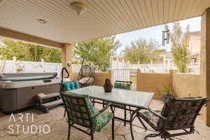 View of patio featuring a hot tub