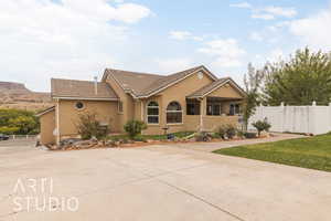 Ranch-style house with a front lawn