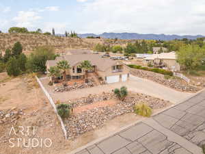 Birds eye view of property featuring a mountain view