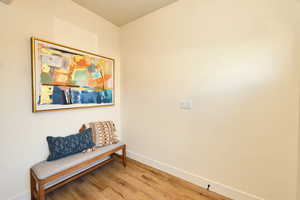 Sitting room featuring light hardwood / wood-style flooring