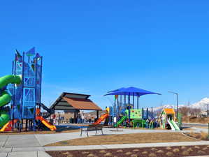 View of playground featuring a mountain view