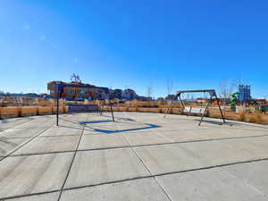 View of basketball court featuring a playground