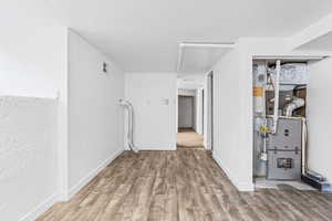 Interior space featuring hardwood / wood-style floors and a textured ceiling