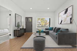 Living room with wood-type flooring