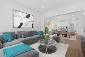 Living room with hardwood / wood-style floors