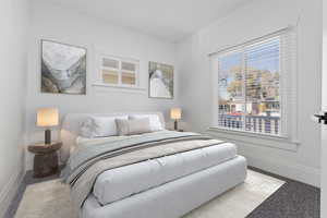 Bedroom with carpet flooring and multiple windows