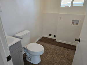 Bathroom featuring vanity and toilet