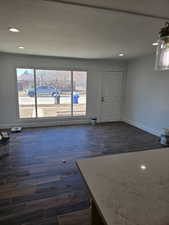 Unfurnished room with dark hardwood / wood-style flooring