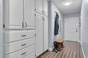 Mudroom with dark wood-type flooring