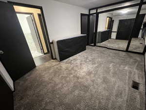 Unfurnished bedroom featuring carpet floors