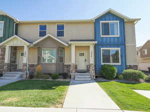 Craftsman-style house with a front yard