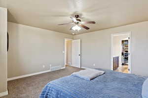 Bedroom with light carpet and ceiling fan