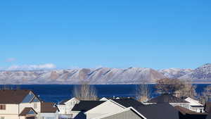 Property view of mountains with a water view