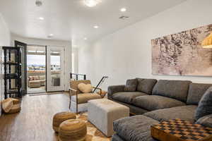 Living room with light hardwood / wood-style floors