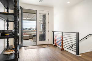 Doorway to outside with hardwood / wood-style floors