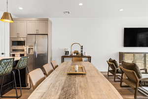 Dining space featuring hardwood / wood-style flooring