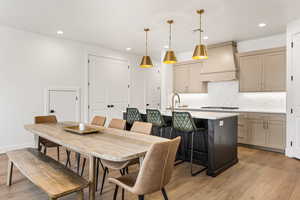 Dining area featuring light hardwood / wood-style floors and sink