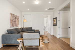 Living room with hardwood / wood-style floors