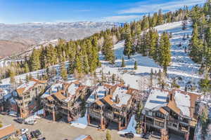 Snowy aerial view with a mountain view