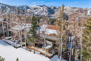 Snowy aerial view featuring a mountain view