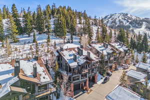 Snowy aerial view featuring a mountain view