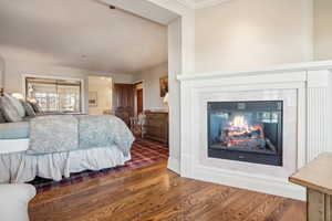 Bedroom with wood-type flooring