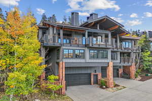 Exterior space with a garage and a balcony