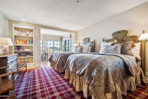 Bedroom with a textured ceiling