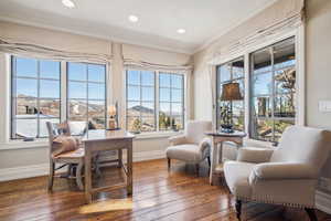 Sunroom / solarium with a mountain view