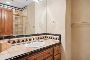 Bathroom featuring vanity and walk in shower