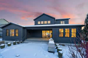 View of snow covered rear of property