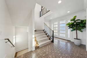 Foyer entrance featuring french doors