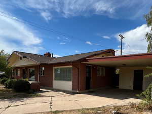 View of front of house with a carport