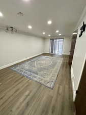 Unfurnished room featuring ornamental molding and light hardwood / wood-style flooring