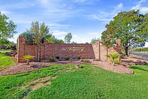 Community sign featuring a yard