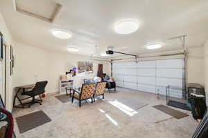 Garage featuring a garage door opener