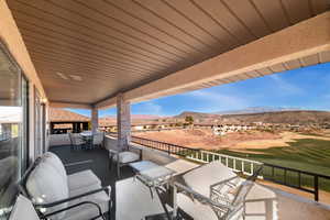 View of patio / terrace with a balcony and a mountain view