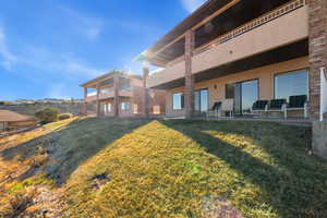 Exterior space featuring a balcony and a patio area