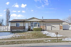 Ranch-style home featuring a garage