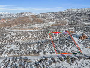 Snowy aerial view with a mountain view