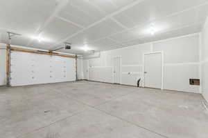 Garage featuring a garage door opener